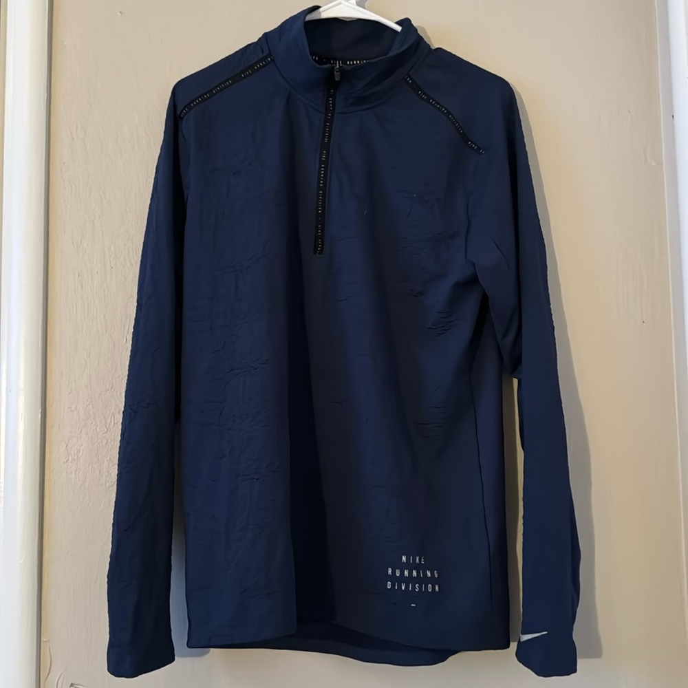 Half zip up shirt. Medium blue Nike jacket